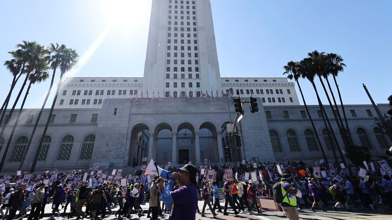 Los Angeles city workers hold a rally outside the city hall during a one-day walkout strike in protest over labor negotiations, in Los Angeles, California, U.S., August 8, 2023. 