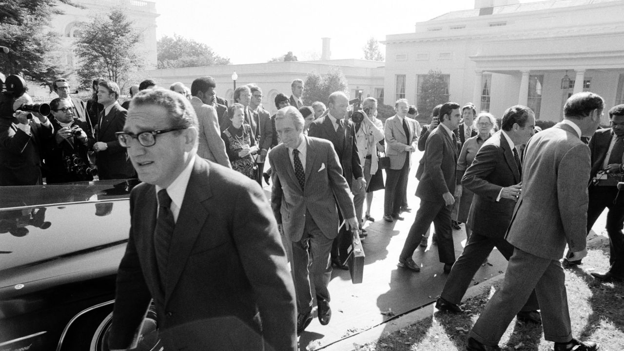Kissinger hurries back to the State Department after meeting with Nixon (to the right with chief-of-staff Al Haig) after discussing the Yom Kippur War, which was raging in Israel in 1973.