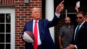 Trump attends college football game in key early-voting state of South Carolina