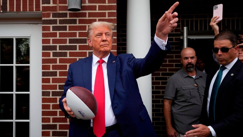 Trump attends college football game in key early-voting state of South Carolina