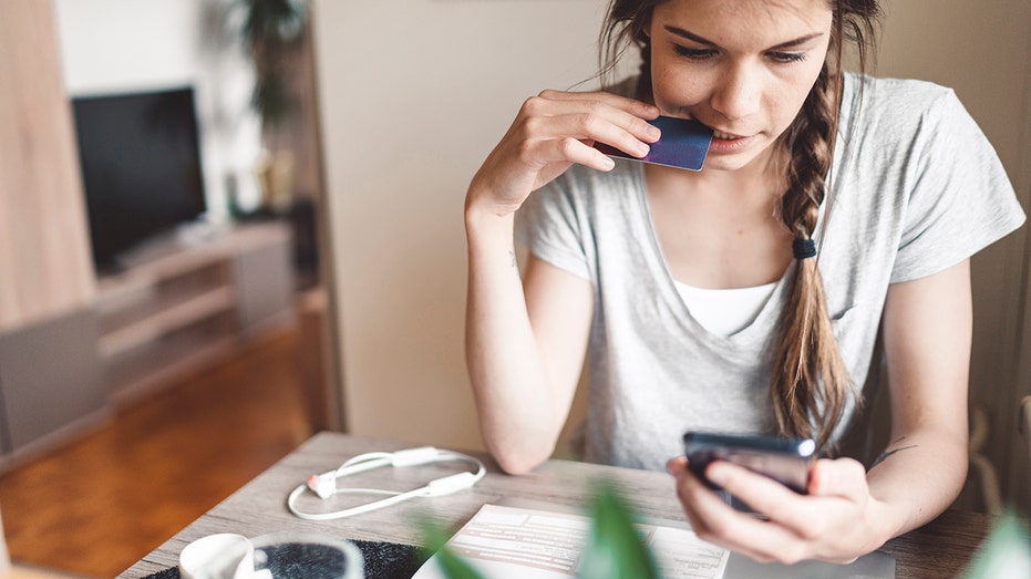 Young adult making payment