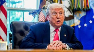 Trump calls for Fed governor's resignation as ally requests DOJ probe